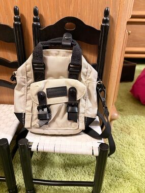 Compact Beige Mini Backpack Crossbody with Black Trim
